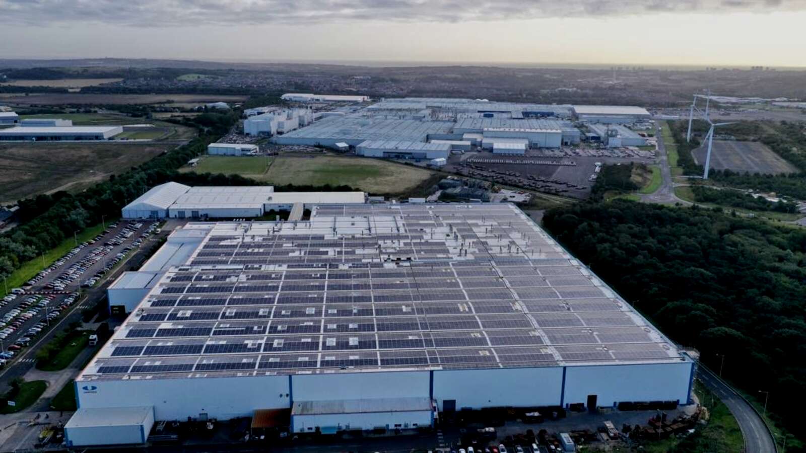 Aerial view of a commercial rooftop solar installation